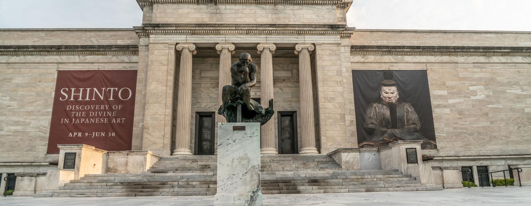 a statue in front of a building